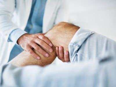 Senior man's knee medical exam