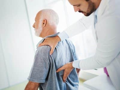 older man with back pain