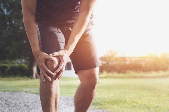 man with knee injury