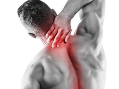 Muscular man with pain in his neck